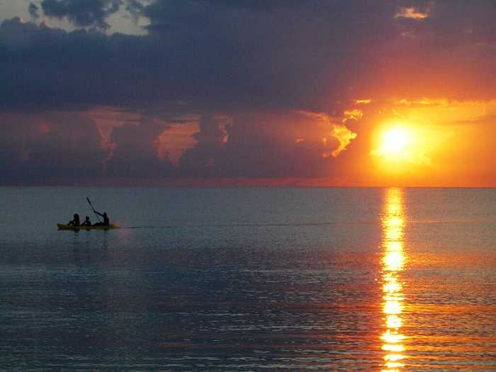 Sunset on the sea at Seven MIle Beach in Jamaica. 