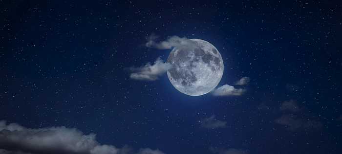 Moon with clouds in the background. 