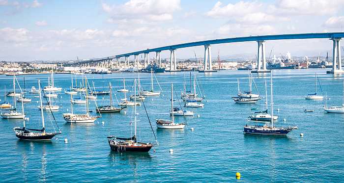 Sailboats in the San Diego waterfront and the Coronado Bridge.